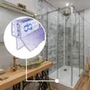 A close-up of a shower door seal with a bathroom scene in the background. Produktbild-Vorschau
