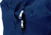 A close-up view of two zippers on a dark blue fabric bag. Produktbild-Vorschau