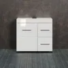 A white vanity cabinet with silver handles is shown against a textured dark gray wall and a dark gray wooden floor. Podgląd zdjęcia produktu