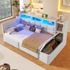 A white daybed with integrated storage and LED lighting, shown in a bedroom setting. Produktbild-Vorschau