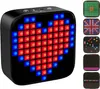 A black Bluetooth speaker with a pixelated heart display and several other pixelated displays shown on the right side. Voir les images du produit