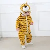 A baby wearing a tiger costume indoors. Produktbild-Vorschau