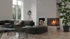 A modern living room with a fireplace, sofa, and coffee tables. Produktbild-Vorschau