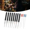 A person is working on a lathe in a workshop, with a set of lock picking tools in the foreground. Produktbild-Vorschau