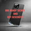 A black smartphone case is shown falling onto a concrete surface, with glowing blue energy emanating from the point of impact. Podgląd zdjęcia produktu