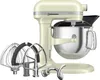 A cream-colored KitchenAid stand mixer with various attachments is displayed against a white background. Produktbild-Vorschau