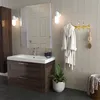 A bathroom vanity with a sink, mirror, and robe hanging on a hook. Produktbild-Vorschau