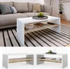 A modern living room scene featuring a white and wood-tone coffee table. Anteprima dell’immagine prodotto