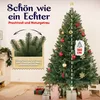 A decorated artificial Christmas tree with gifts underneath, in a room setting. Produktbild-Vorschau