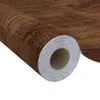 A roll of self-adhesive vinyl film with a dark oak wood grain pattern. Náhľad obrázku produktu