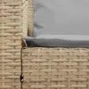 A close-up view of the woven texture of a beige outdoor sofa with a gray cushion. Náhled obrázku produktu