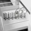 A black metal pot lid organizer is shown in an open white drawer, holding two glass pot lids. Náhled obrázku produktu