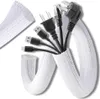 A white cable sleeve is shown containing various black cables and plugs, including USB cables, an Ethernet cable, and power plugs. A separate piece of the sleeve is shown in the upper left corner. Náhľad obrázku produktu
