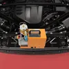 A portable high-pressure pump is placed on the engine bay of a car. Produktbild-Vorschau