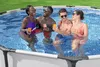 Four people are enjoying themselves in an above-ground swimming pool, holding drinks. Produktbild-Vorschau