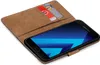 A brown leather flip case for a Samsung Galaxy A5 2017 phone, with two credit cards inserted into a slot on the inside cover. Produktbild-Vorschau