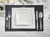 A table setting with plates, cutlery, bread, olives, and butter. Produktbild-Vorschau