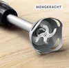 Close-up of an immersion blender blade and shaft on a wooden surface. Produktbild-Vorschau