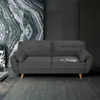 A dark gray sofa is shown in a modern living room setting with a marble-patterned wall and a patterned wallpaper. Voir les images du produit