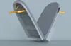 A gray folding ironing board with yellow handles against a light gray background. Náhľad obrázku produktu