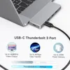 A USB-C Thunderbolt 3 hub adapter is connected to a laptop, with feature callouts below. Produktbild-Vorschau