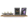 A wooden shelf with a candle holder and two framed pictures. Produktbild-Vorschau