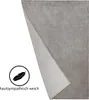 A gray blanket is shown partially unfolded against a white background, with a feather icon and text indicating it is soft and skin-friendly. Produktbild-Vorschau