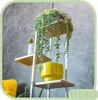 A modern shelving unit with plants and a yellow pot against a textured gray wall. Anteprima dell’immagine prodotto