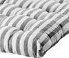 A close-up view of a tufted cushion with a striped pattern. Anteprima dell’immagine prodotto