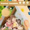 Two young children are playing inside a wooden playhouse with colorful blocks and stuffed animals. Anteprima dell’immagine prodotto