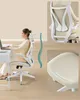 A woman is sitting at a desk in an ergonomic chair, with close-ups of the chair's back and seat. Náhled obrázku produktu