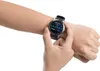 A person's arm wearing a smartwatch that is measuring heart rate. Produktbild-Vorschau