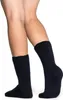 A close-up shot of a person's legs wearing dark socks. Produktbild-Vorschau