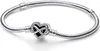 A silver bracelet with a heart-shaped charm featuring an infinity symbol and small stones. Anteprima dell’immagine prodotto