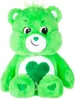 A green plush toy bear with a heart symbol on its chest. Produktbild-Vorschau