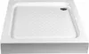 A white shower tray with a textured surface and a drain hole. Náhled obrázku produktu