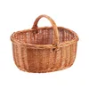 A woven basket with a handle against a white background. Náhled obrázku produktu