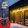 A winter scene with Christmas lights decorating the exterior of a house. Náhled obrázku produktu