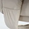 A close-up view of a cream-colored recliner chair's side pocket. Anteprima dell’immagine prodotto