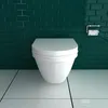 A white toilet bowl is shown in front of a dark green tiled wall and a white tiled floor. Produktbild-Vorschau