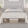 A white metal bed frame with a cloud-patterned headboard is shown in a bedroom setting. Produktbild-Vorschau