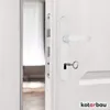 A close-up shot of a white door with a white door handle and a key inserted into the lock. Náhled obrázku produktu