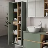 A modern bathroom with a green vanity and a tall cabinet. Náhled obrázku produktu