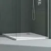 A modern shower tray with a drain in a minimalist bathroom setting. Produktbild-Vorschau