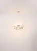 A chandelier hanging from a white ceiling. Anteprima dell’immagine prodotto