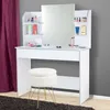 A white vanity table with a mirror and a white stool in front of it. Náhled obrázku produktu