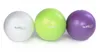 Three pilates balls of different colors lined up against a white background. Produktbild-Vorschau