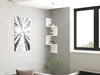 A modern living room corner with a white zigzag shelf mounted on a gray wall, displaying a few decorative items and books. A large window with a black frame is visible on the right, and a piece of abstract art hangs on the left wall. Anteprima dell’immagine prodotto