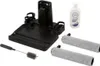 A set of accessories for a vacuum cleaner, including a charging dock, cleaning rollers, a cleaning brush, and a bottle of cleaning solution. Produktbild-Vorschau