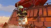A LEGO Boba Fett character is shown in a desert environment, standing on a platform with a large brown ship in the background. Produktbild-Vorschau